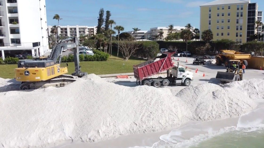 New sand arrives at Naples Beach