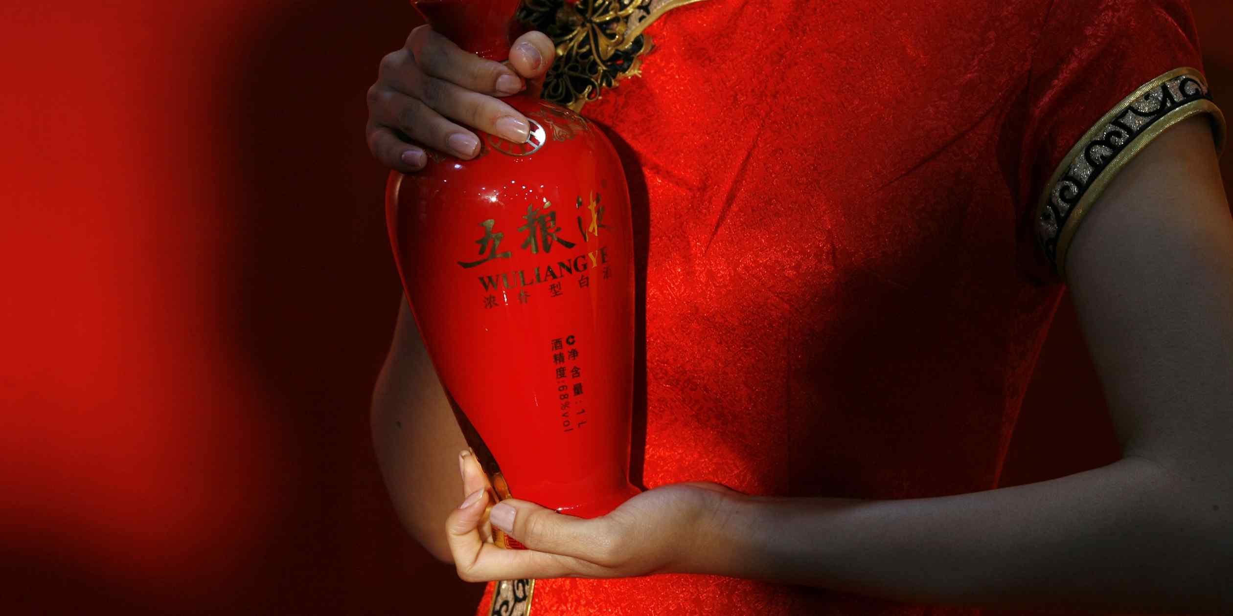 Scandal-hit ‘baijiu’ maker sharply revises earnings with chairman missing