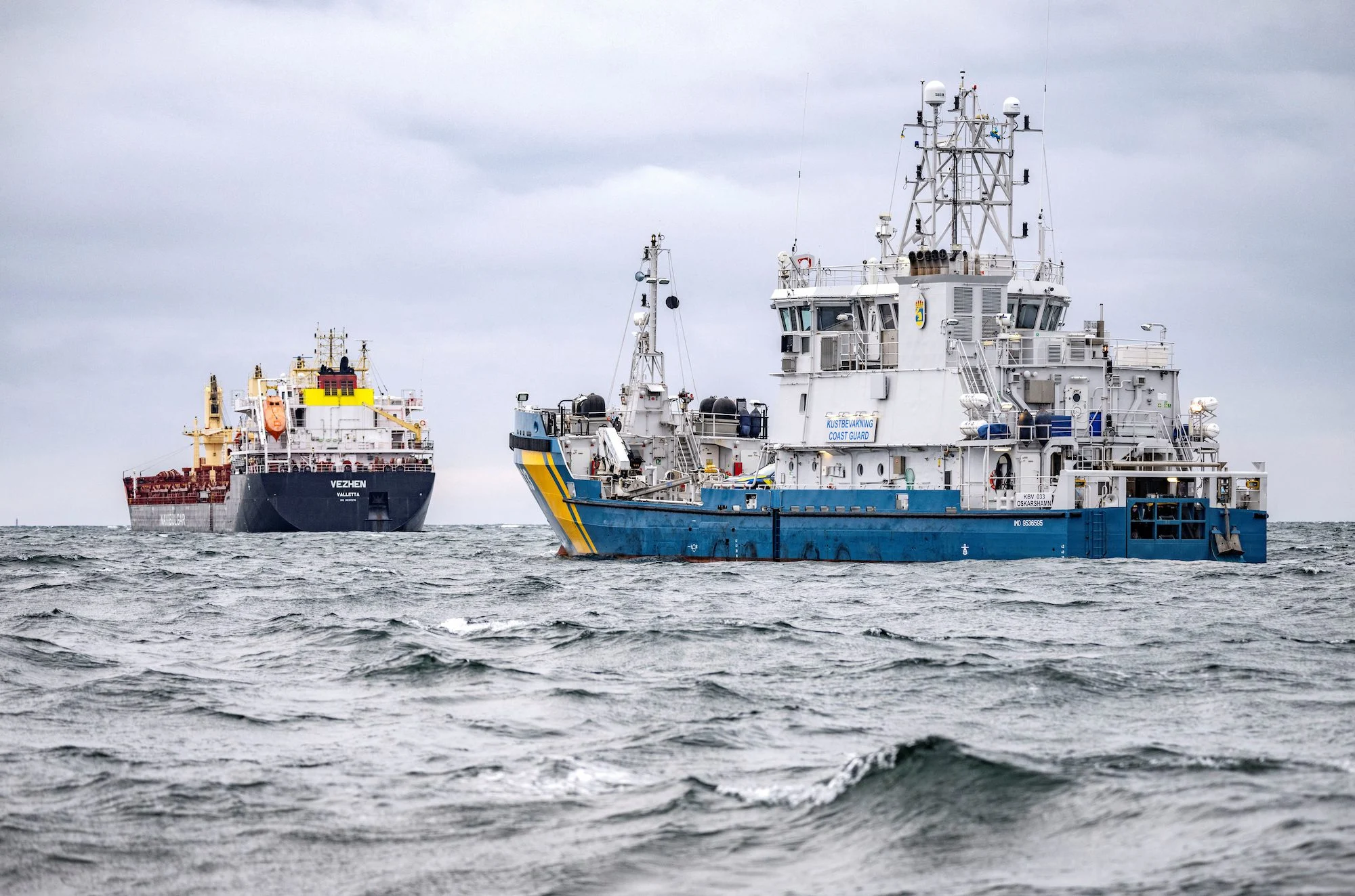 The Swedish Coast Guard vessel KBV 033, and the cargo ship Vezhen, which is under seizure while it is being investigated by Swedish authorities, are anchored outside Karlskrona, Sweden, January 27, 2025
