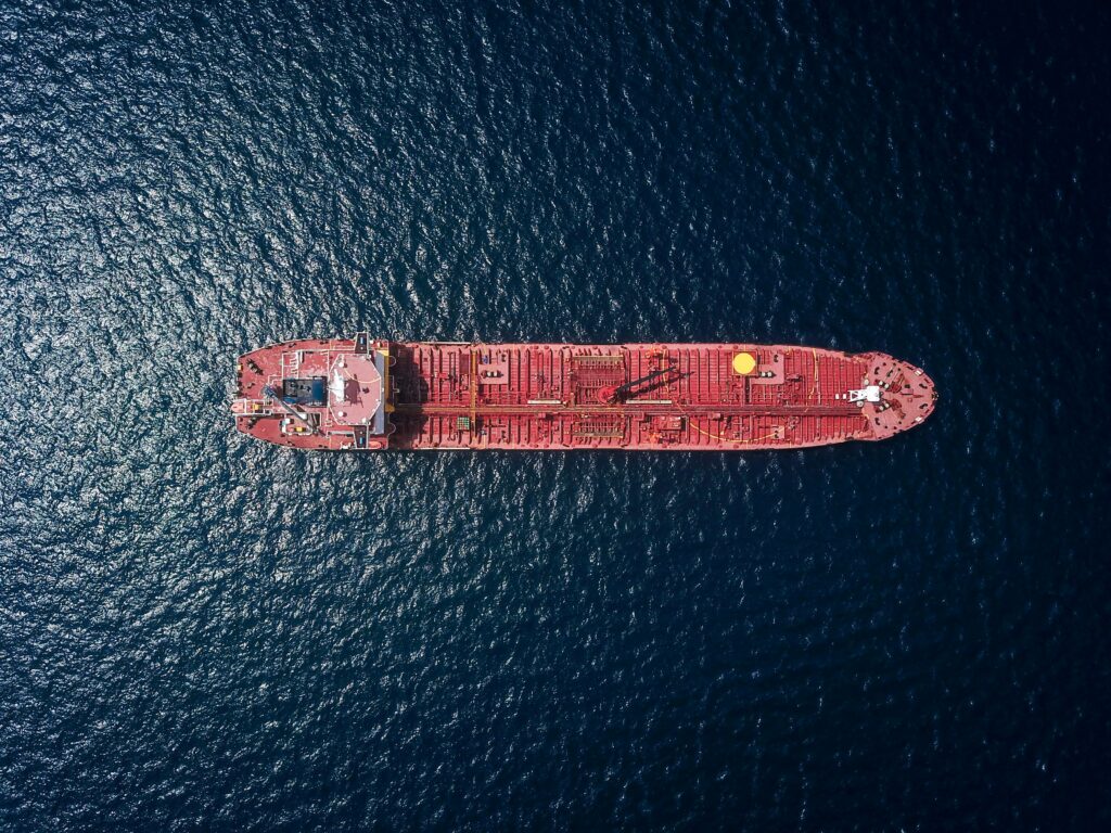 Red ship aerial view in the sea