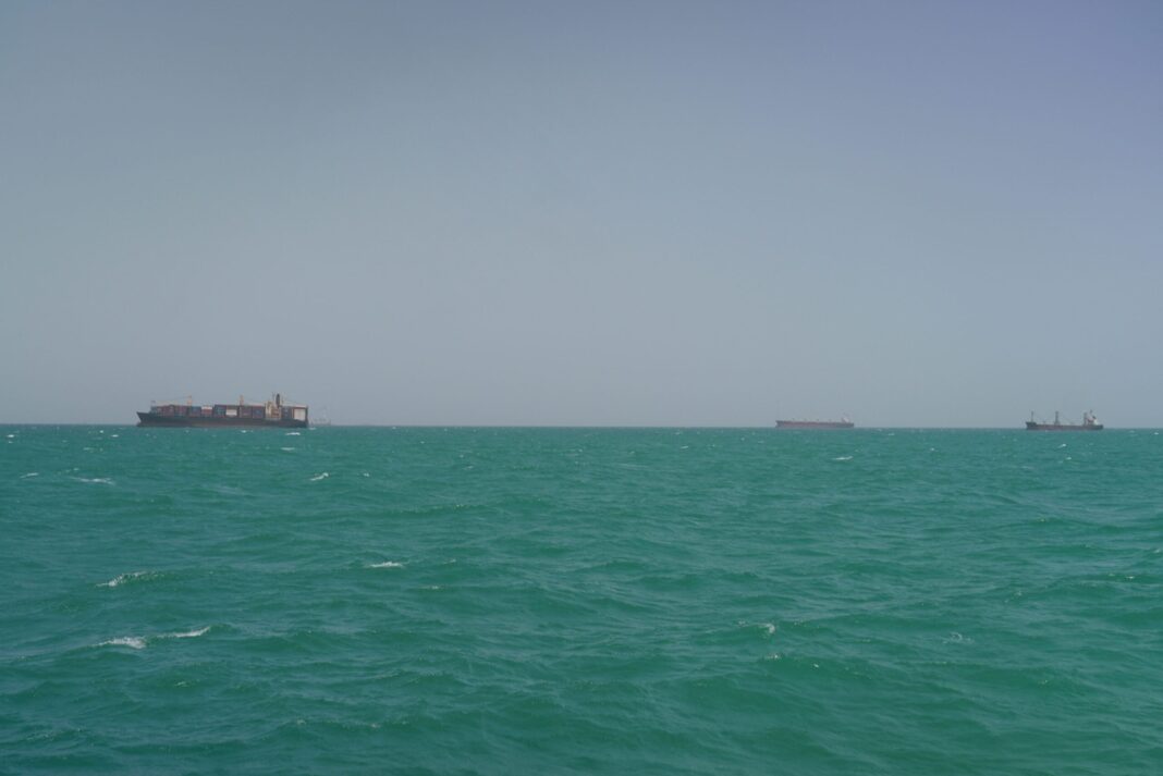 Cargo ships sail in Saudi waters near the Dammam Port in Dammam