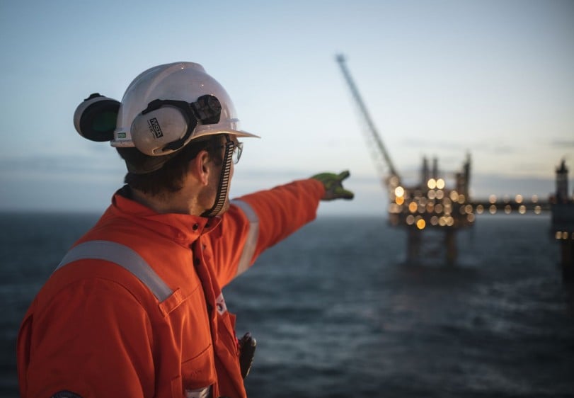 TotalEnergies, BluEnergies enhancing Liberia’s oil & gas offshore exploration prospects Man pointing at offshore platform