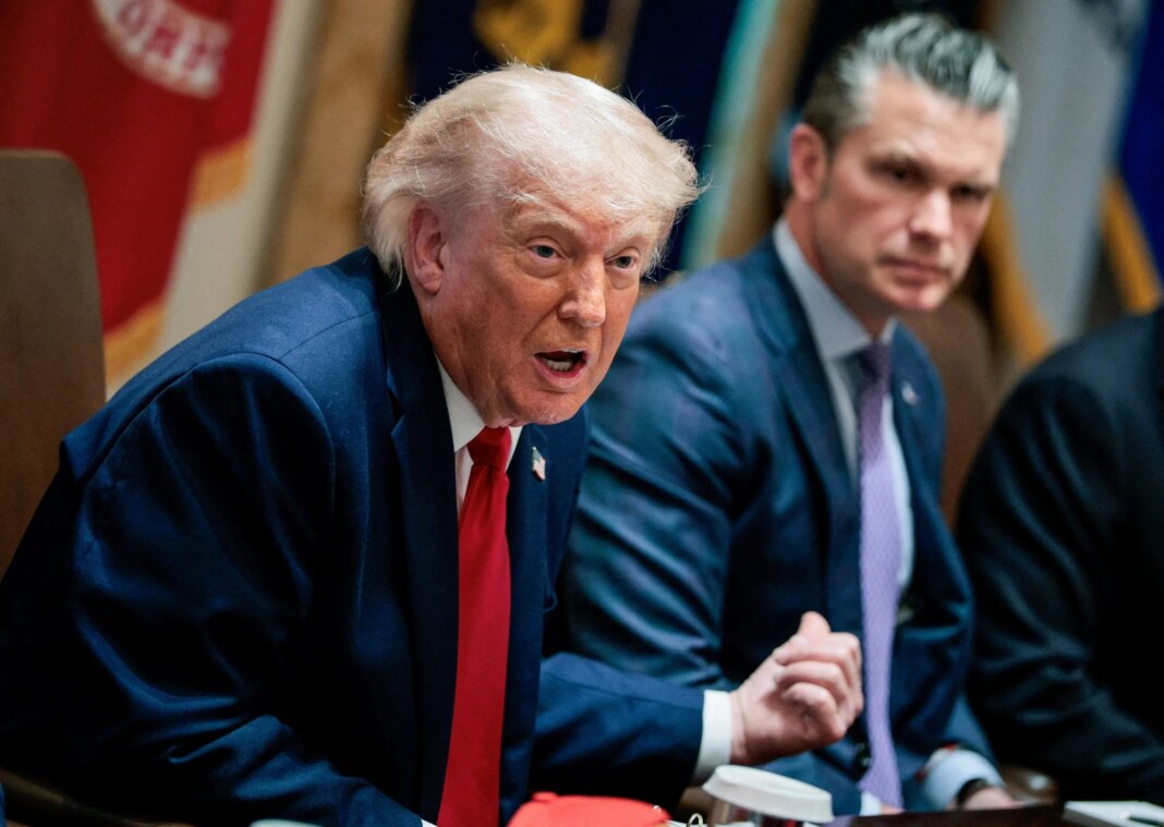 Trump Declares Iran Ceasefire Over as U.S. Unveils New Sanctions FILE PHOTO: U.S. President Donald Trump speaks next to Defense Secretary Pete Hegseth during a cabinet meeting in the Cabinet Room at the White House